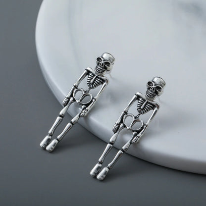 EtherealBe Halloween skeleton earrings for women made of silver-toned metal with detailed skeleton design