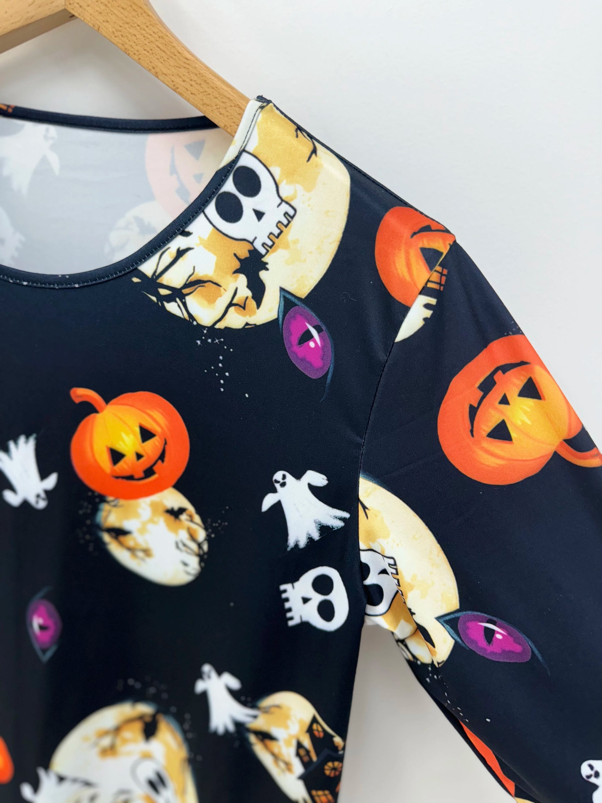 EtherealBe plus size Halloween pumpkin T-shirt featuring a spooky design with ghosts and pumpkins