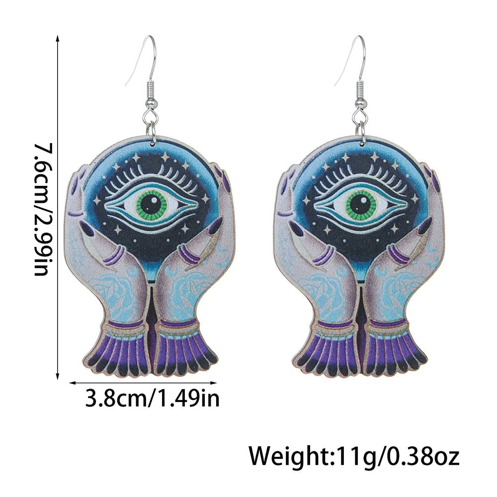 EtherealBe Halloween devil eye earrings featuring hands holding an eye design with vibrant colors