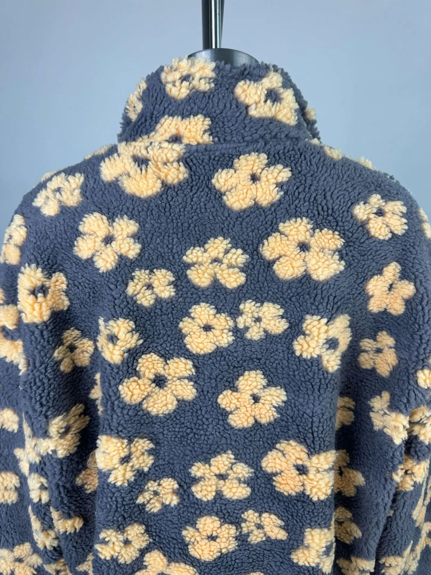 EtherealBe cozy lambskin coat for women with a floral pattern and soft fleece texture on the back