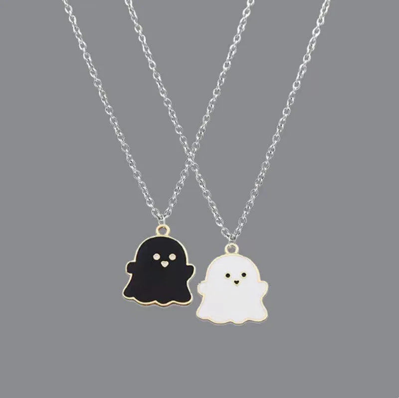 EtherealBe Halloween ghost pendant necklace featuring black and white ghost charms on silver chains