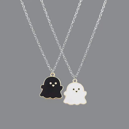 EtherealBe Halloween ghost pendant necklace featuring black and white ghost charms on silver chains