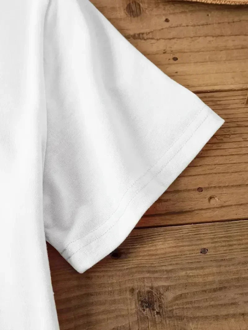 Detail of the sleeve on a plus size Halloween witch shirt in a cozy white fabric