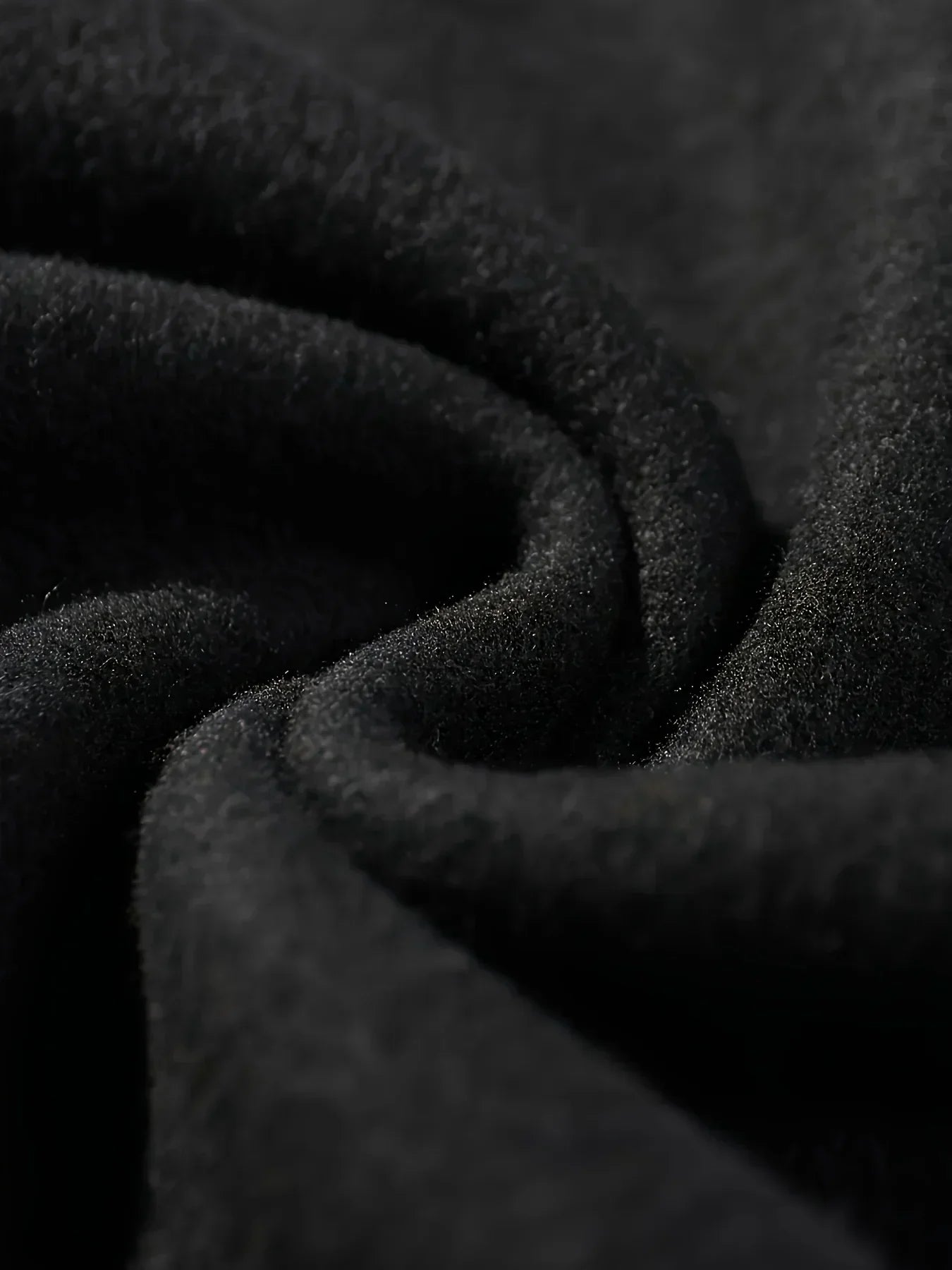 Close-up of soft fabric showcasing a black Halloween spooky hoodie for women