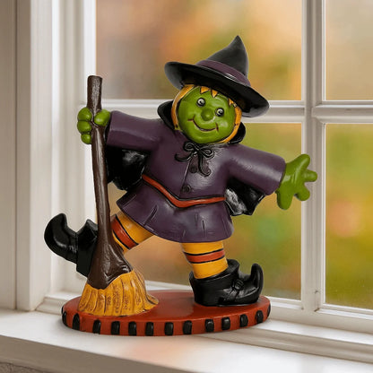 Colorful Halloween witch figurine with a broom and playful expression for festive decor