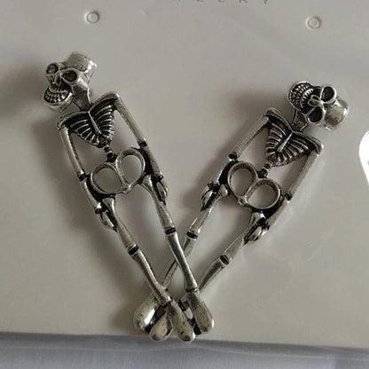 EtherealBe Halloween skeleton earrings for women featuring detailed silver skeleton designs