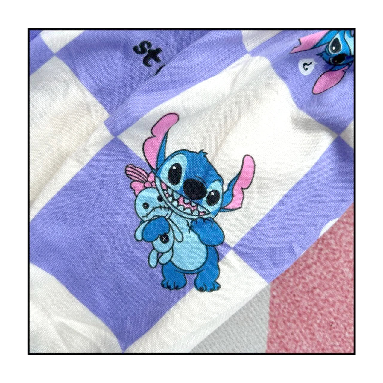 Children's Stitch pajamas set featuring a cute Stitch character with a plush toy on a purple checkered background