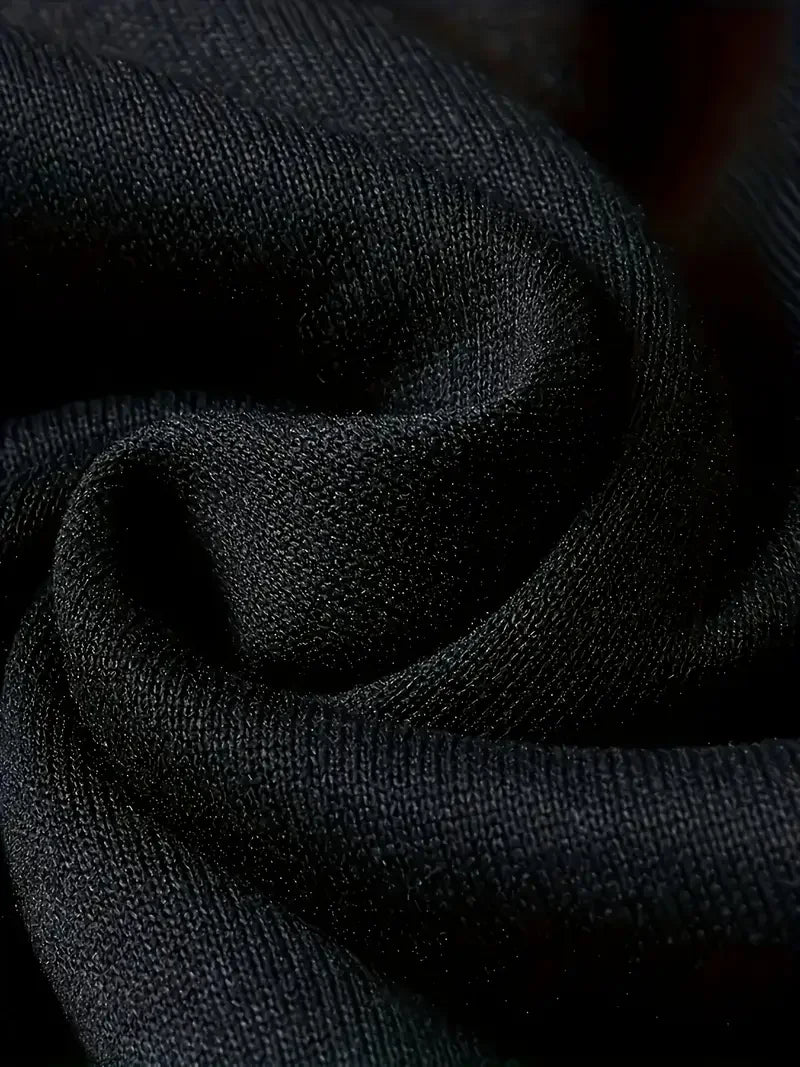 Close-up of soft black fabric for women's Halloween skeleton hoodie with a smooth texture