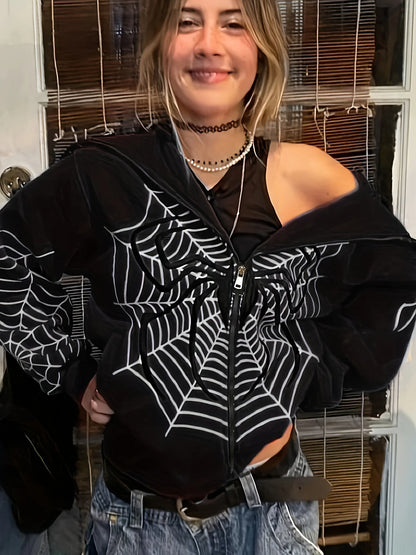 Model wearing black spider web zipper hoodie for women with white web print off shoulder style and jeans