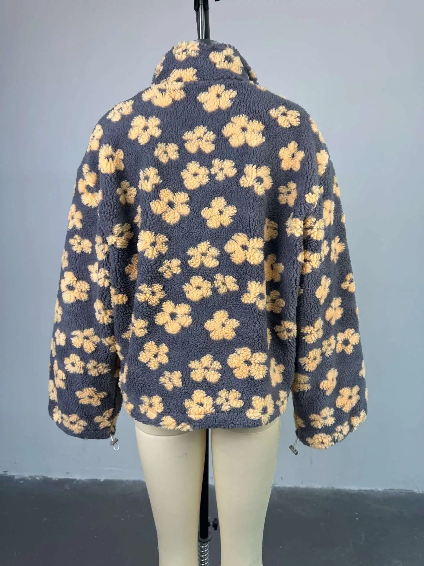 Cozy lambskin coat for women in gray with floral pattern, perfect for stylish warmth