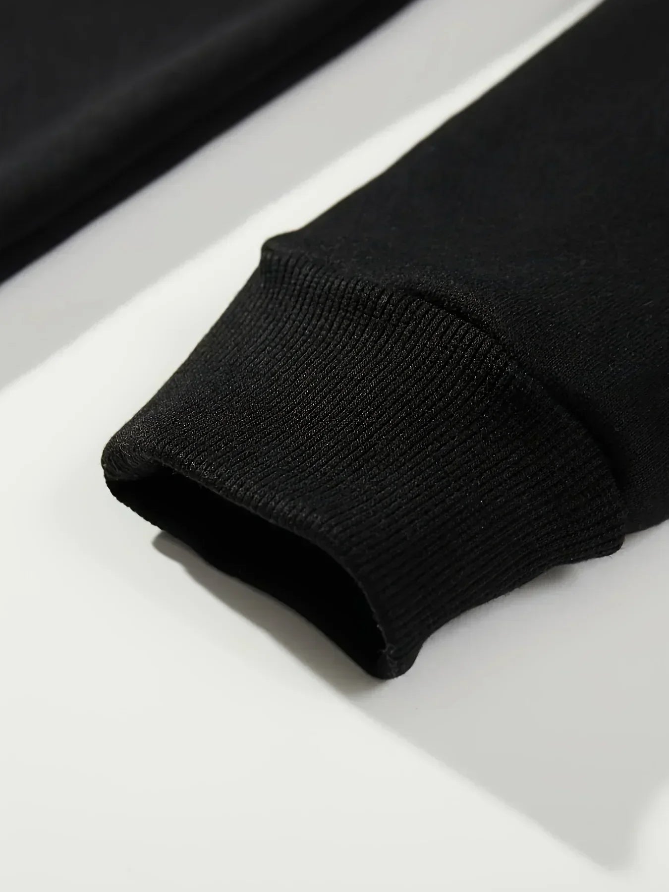 Close-up of the cuff of an EtherealBe Halloween spooky hoodie for women in black fabric