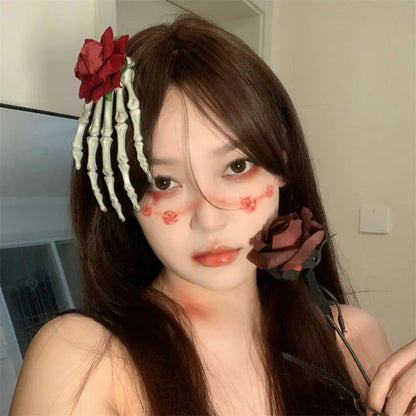 Model wearing a women's Halloween skull hairpin with roses for a spooky, festive look