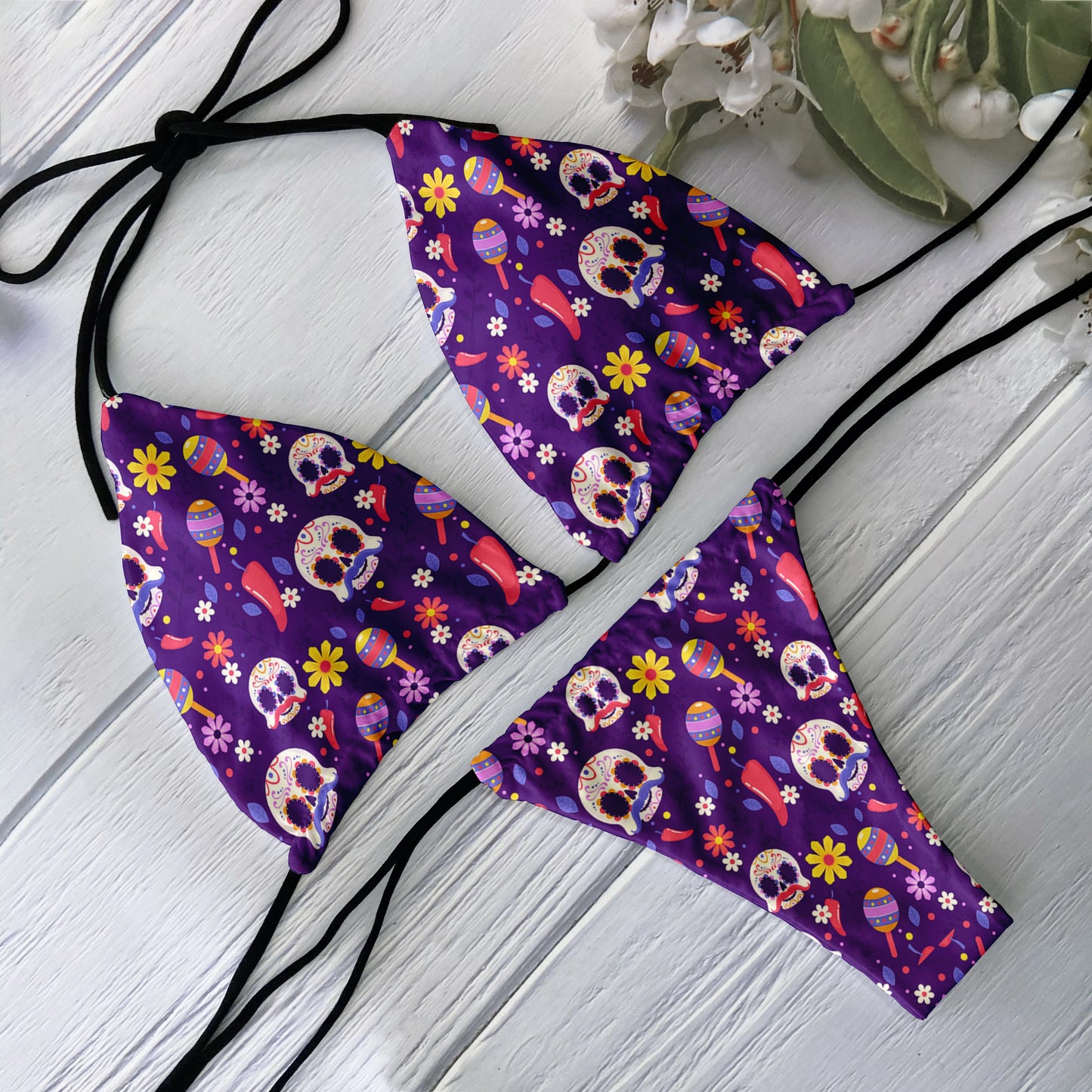EtherealBe purple two piece skull print bikini set with colorful sugar skulls floral pattern and black tie straps