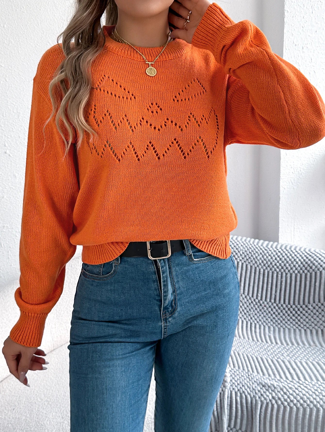 EtherealBe women's pumpkin sweater in bright orange with a playful jack-o'-lantern design