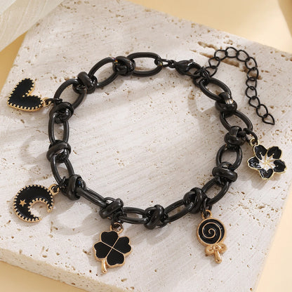 EtherealBe Halloween charm bracelet for women featuring black links and spooky charms