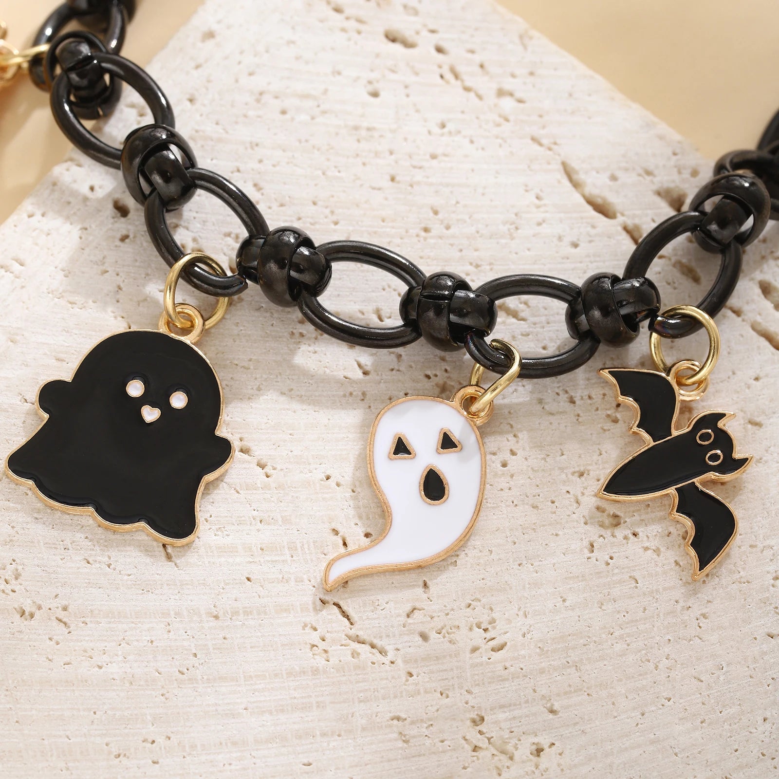 EtherealBe Halloween charm bracelet for women featuring ghost and bat charms in gold and black