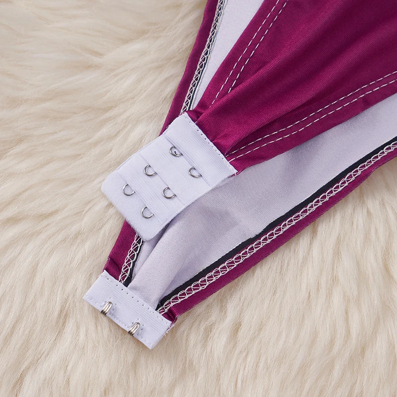 Close up of magenta bodysuit hook and eye closure on white lining for kawaii cartoon bodysuit costume for women