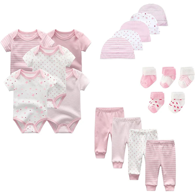 EtherealBe newborn unisex layette set featuring onesies, hats, socks, and pants in soft pink and white designs