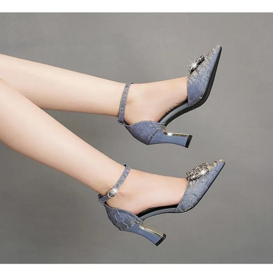 Stylish women's thin heeled dress shoes in blue lace with jeweled embellishments for elegant occasions