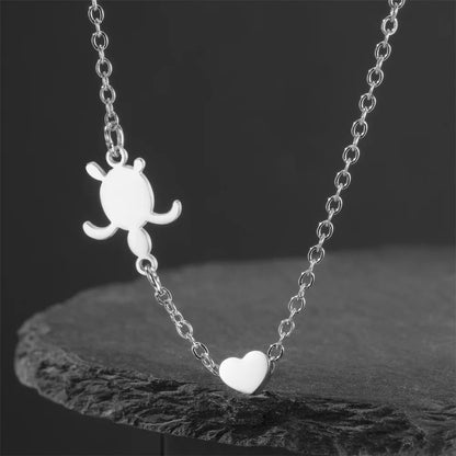 Stylish sea turtle pendant necklace for women with a heart design in silver metal
