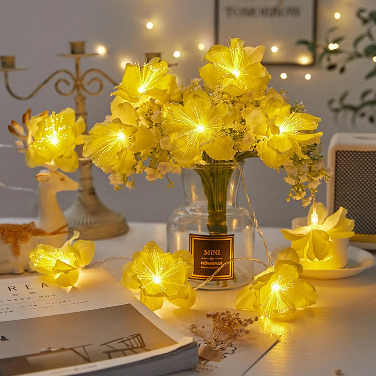 EtherealBe fairy flower string lights with soft yellow blooms illuminating a cozy table setting