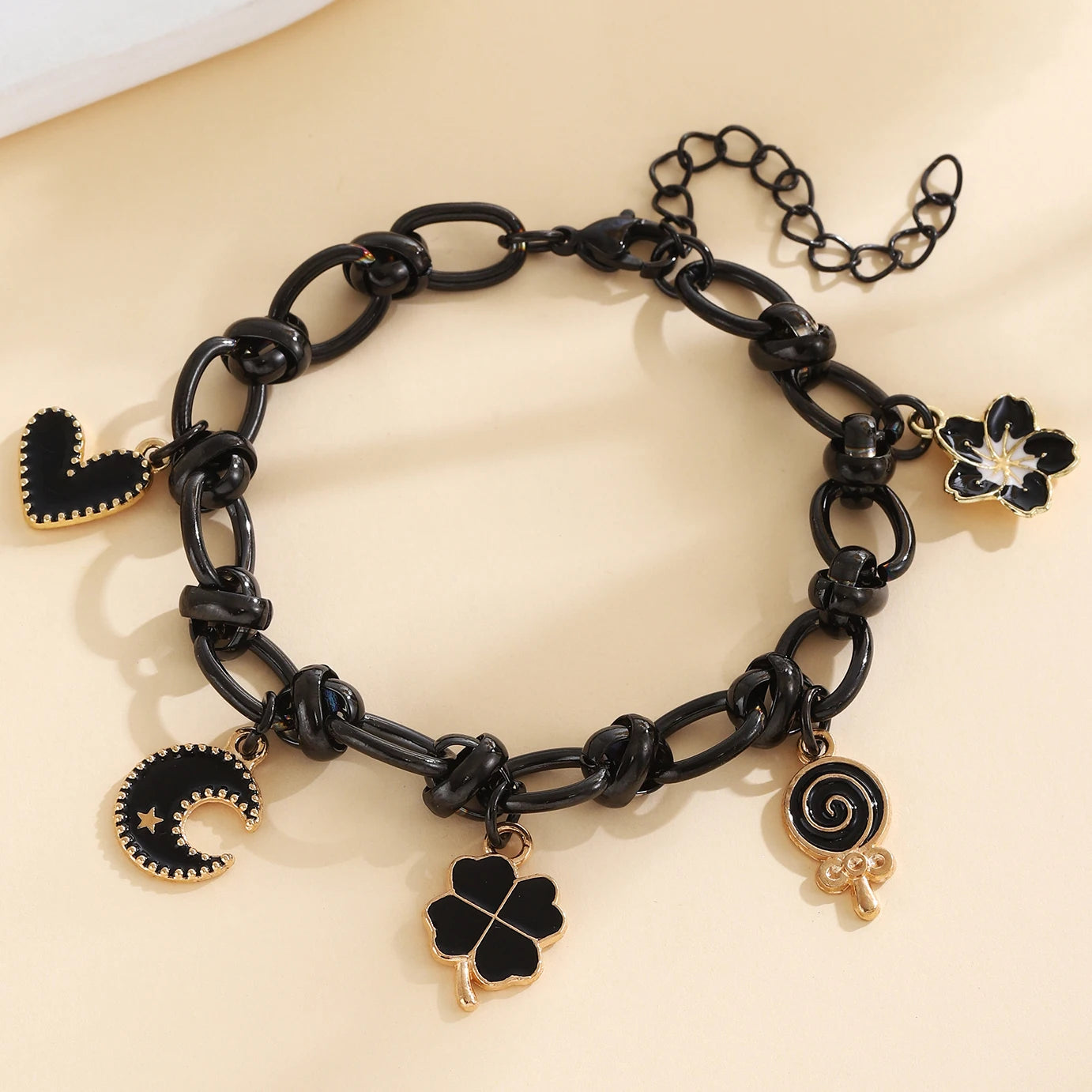 EtherealBe Halloween charm bracelet for women featuring black charms and gold accents