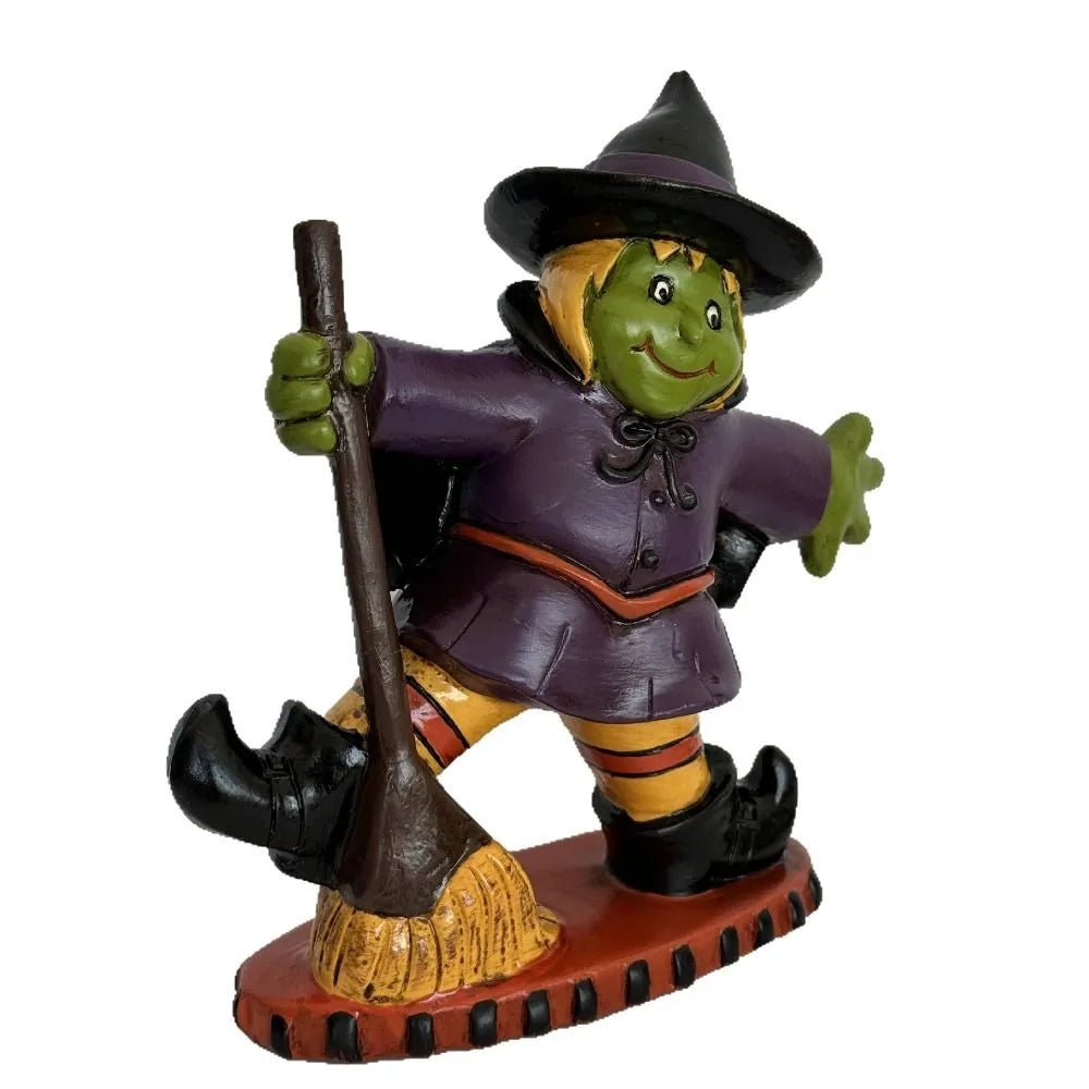 Colorful Halloween witch figurine with broom and playful pose for festive Halloween decor