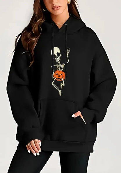 Women's Halloween skeleton hoodie in black featuring a playful skeleton with a pumpkin design