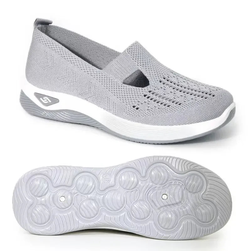 Lightweight women's walking flats in gray with breathable design and cushioned sole for all-day comfort
