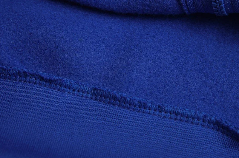EtherealBe close up of soft royal blue fleece seam and zipper detail on spider web zipper hoodie for women