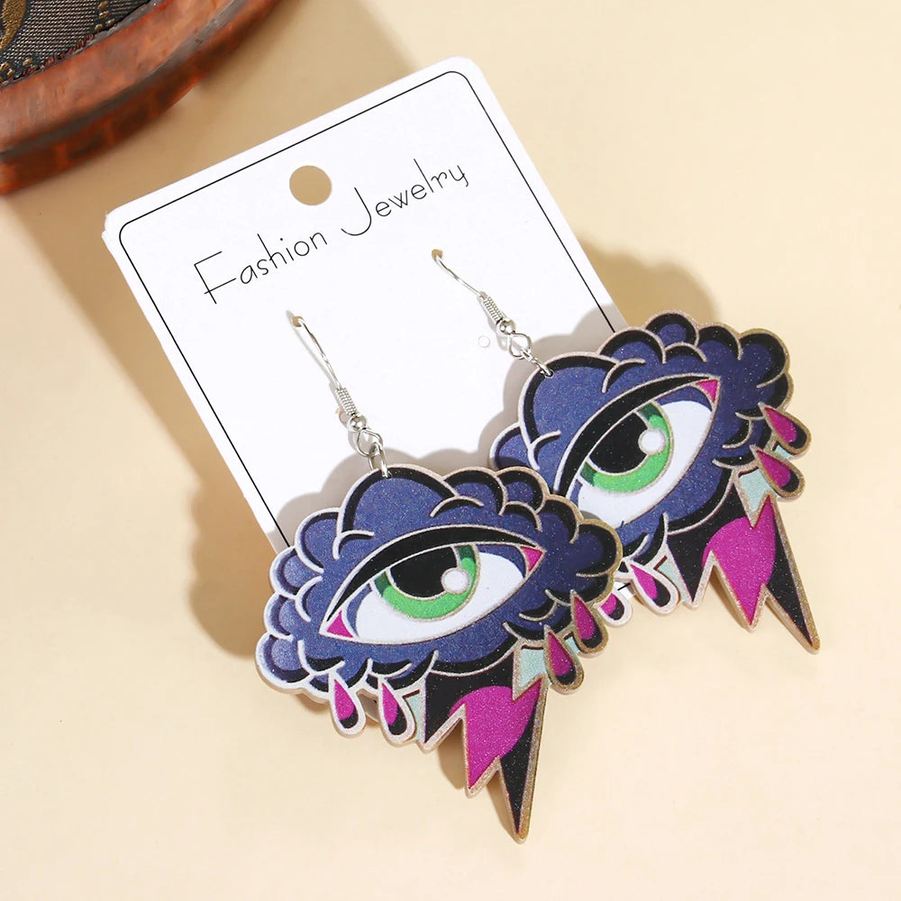 EtherealBe Halloween devil eye earrings featuring colorful eye designs with purple and green accents