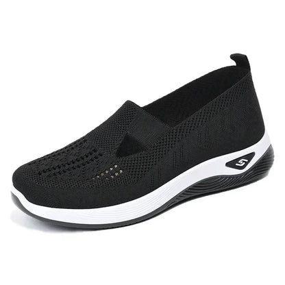Black lightweight women's walking flats with breathable mesh design and slip-on style for comfort