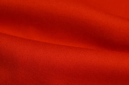 Close up bright red fabric texture for EtherealBe spider web zipper hoodie for women showing knit detail