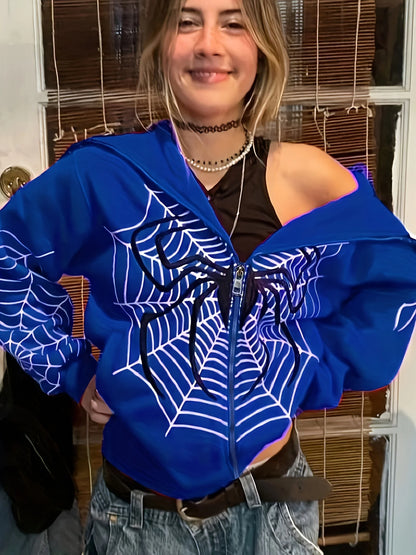 Young woman wearing EtherealBe blue spider web zipper hoodie for women styled off shoulder with jeans