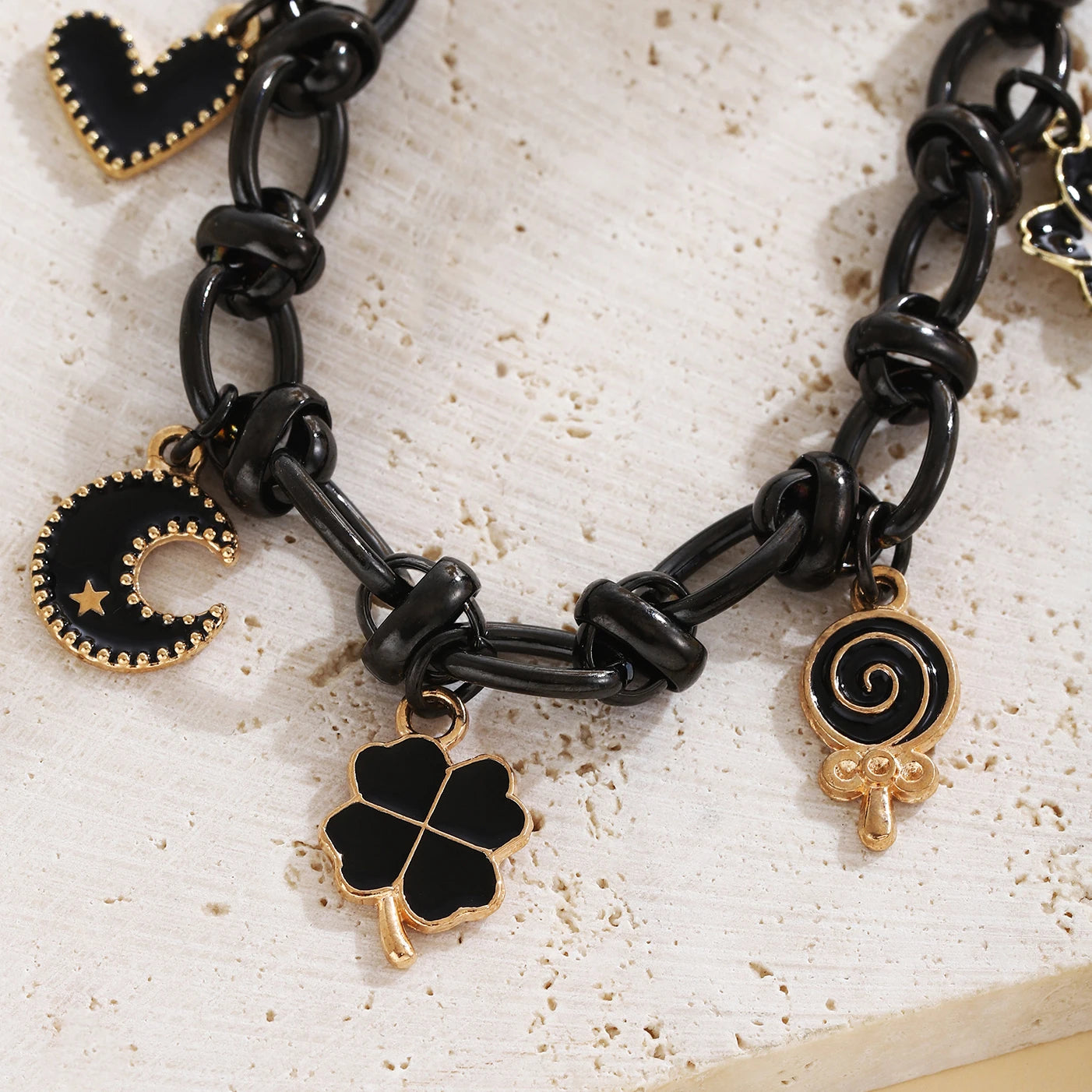 EtherealBe Halloween charm bracelet for women featuring black and gold charms and candy designs