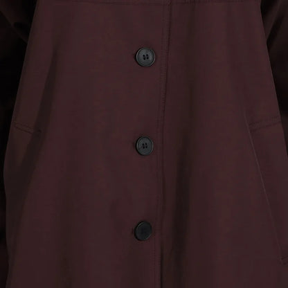 Simple style long sleeve trench coat in deep maroon with button closure and front pockets