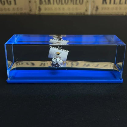 One Piece Thousand Sunny drift bottle decorative toy in clear acrylic case with blue base miniature ship for desk display