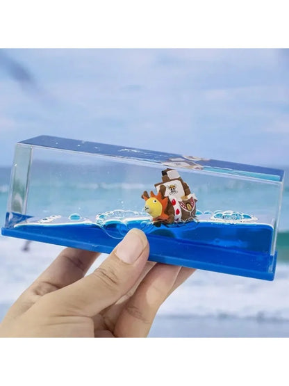 Handheld One Piece Thousand Sunny drift bottle decorative toy showing miniature ship on blue waves in clear case