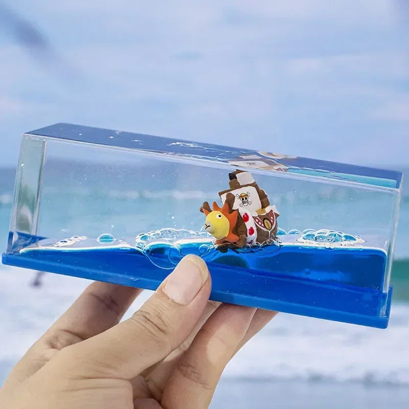 Handheld One Piece Thousand Sunny drift bottle decorative toy with mini Sunny ship sailing in blue resin sea