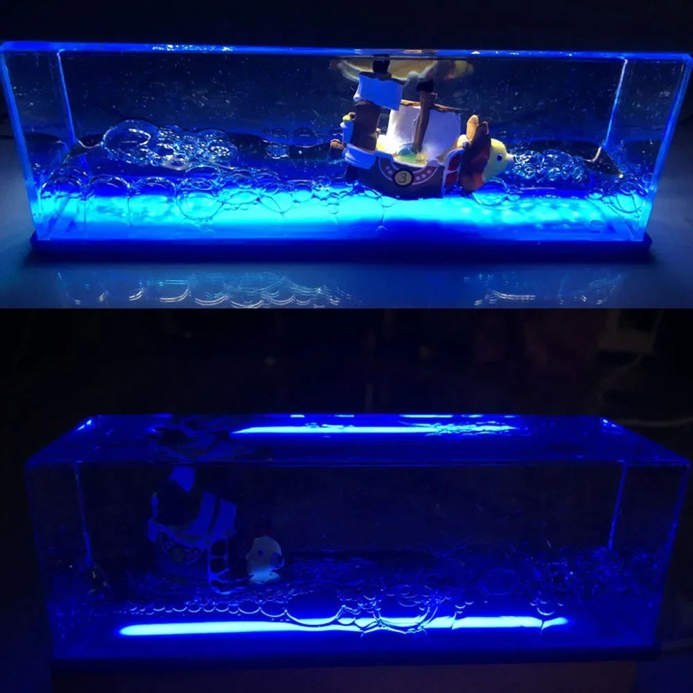 Blue LED resin display featuring One Piece Thousand Sunny drift bottle decorative toy inside ocean wave bubbles