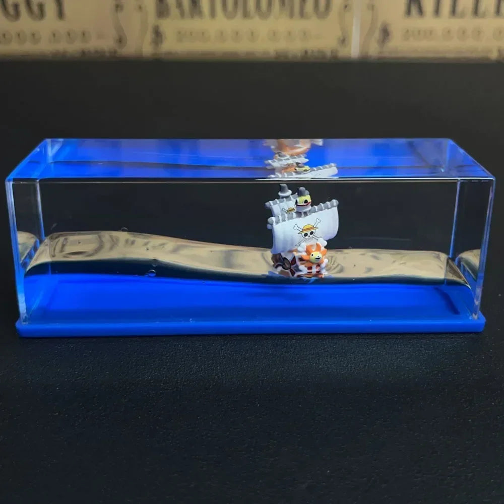 One Piece Thousand Sunny drift bottle decorative toy miniature ship in clear acrylic display case with blue base