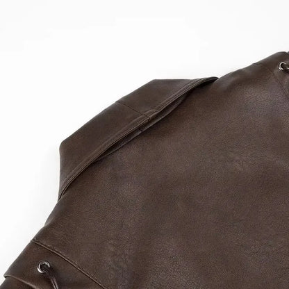 EtherealBe brown half collar faux leather jacket close up of back yoke and folded collar with metal eyelets
