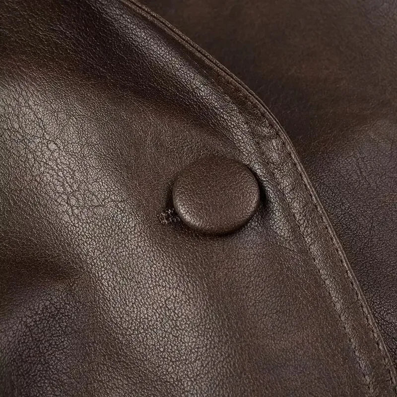 EtherealBe brown half collar faux leather jacket close up showing textured material button and seam