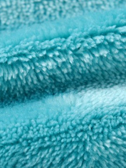 Close up teal plush fleece fabric texture for snorlax baby cosplay bodysuit costume showing softness