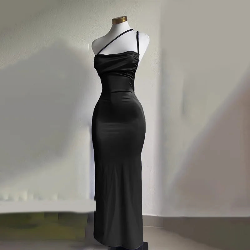 Elegant black backless evening sling dress showcasing a sleek silhouette and stylish design