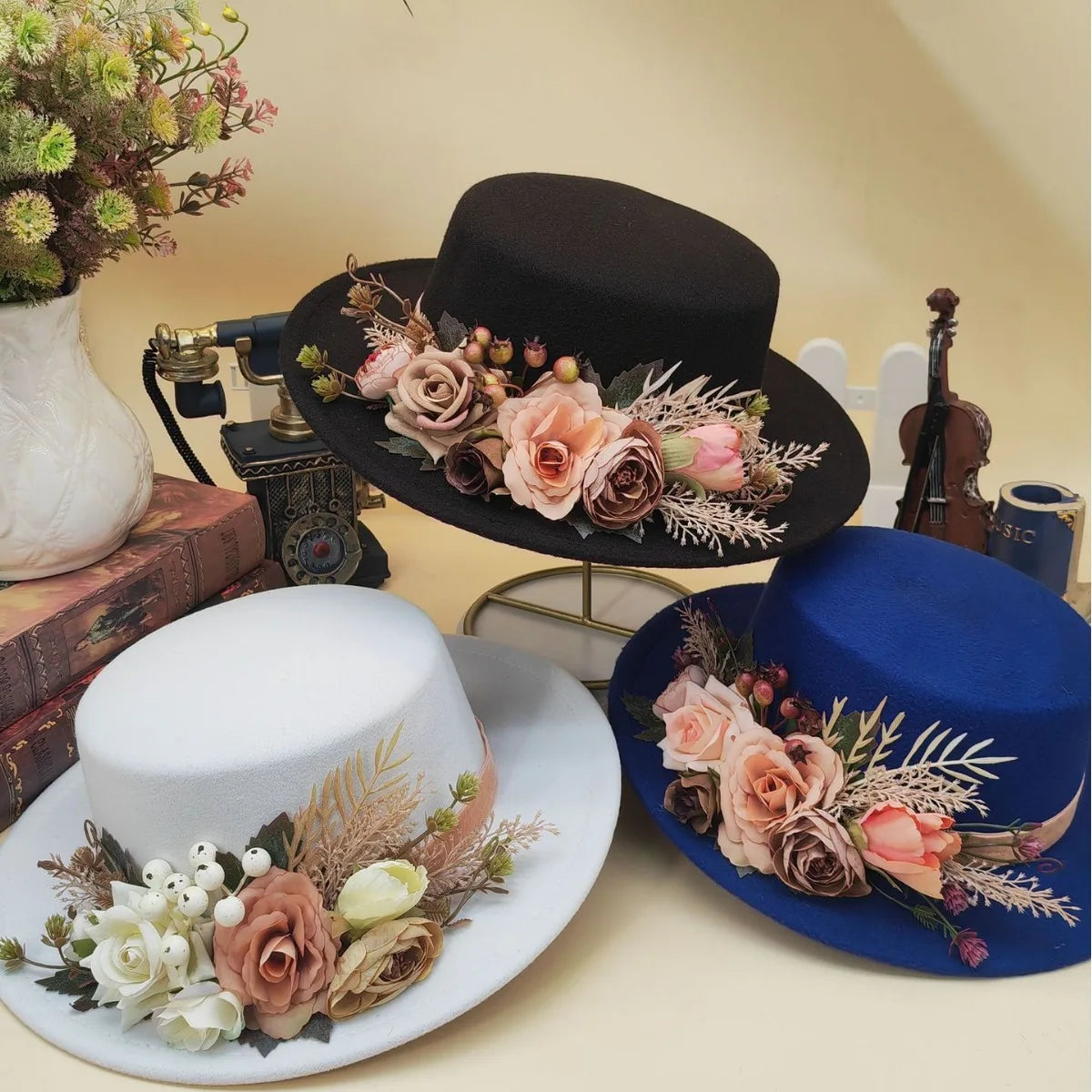 Basin flower fedora hat collection in black, white, and blue with decorative floral accents
