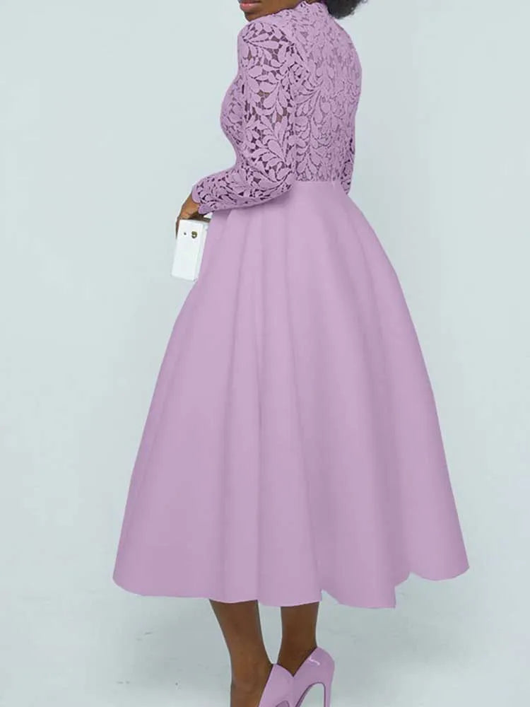 Woman in lavender midi with floral lace bodice and full skirt holding white clutch elegant lace party dress for women