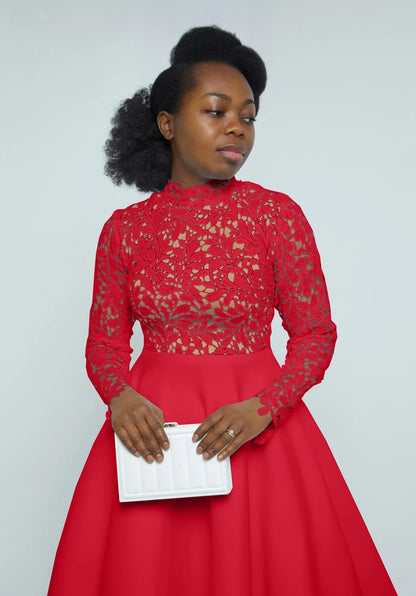Woman in red high neck long sleeve gown with lace bodice and full skirt holding white clutch elegant lace party dress for women