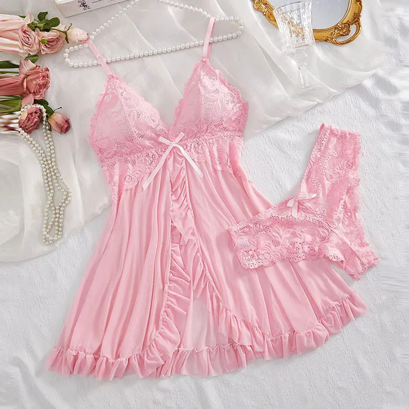 Pink lace nightgown set for women with matching cheeky panties on white satin bed with pearls and roses