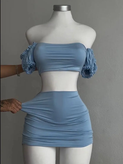 Light blue ruched lace up tube top and skirt set on mannequin with puff sleeves and fitted mini skirt